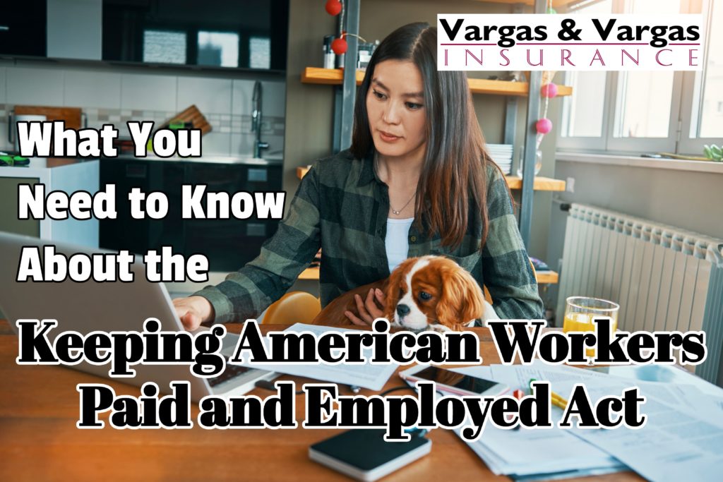 entrepreneur working at home in her kitchen due to COVID-19 and reading about the Keeping American Workers Paid and Employed Act