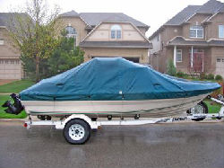 Prepare Your Boat for Fun in the Sun - Boat with tarp and trailer.jpg